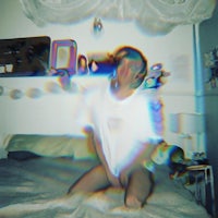 a person sitting on a bed